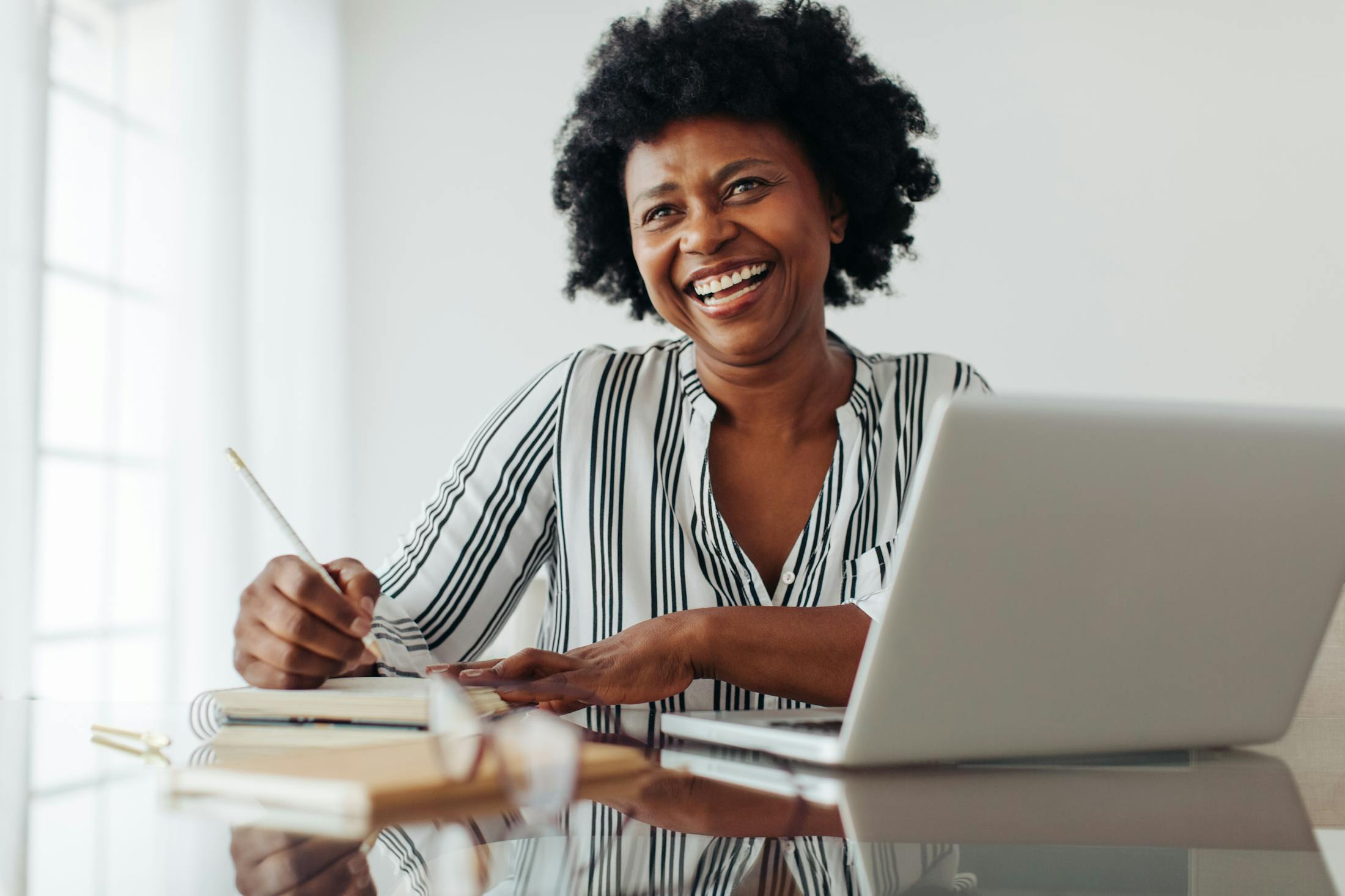 woman writing in her notebook