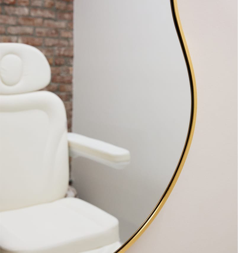 reflection of surgical chair in a mirror