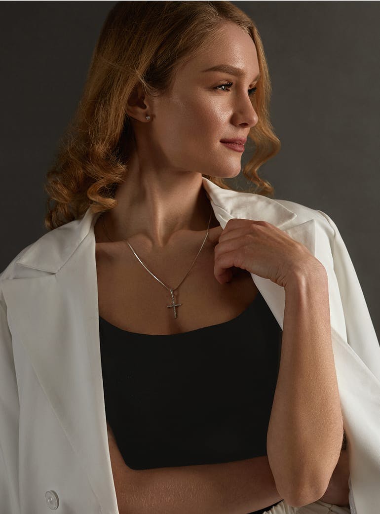 woman with curly hair wearing a white coat