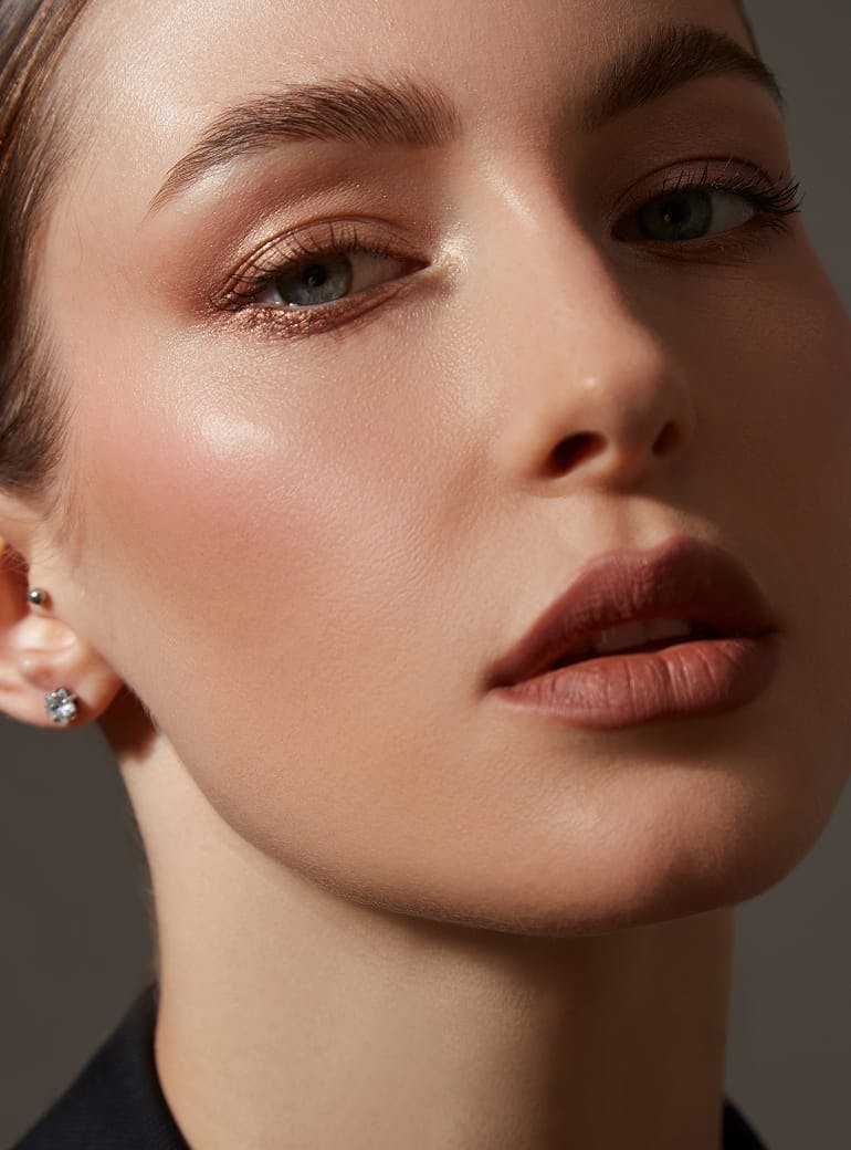 woman with clear skin wearing makeup