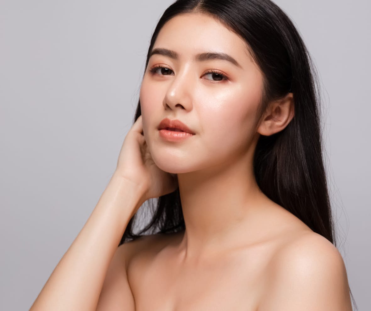 woman touching the back of her head