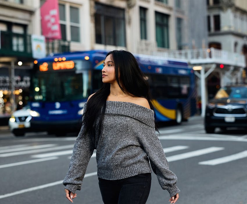 woman walking on city street