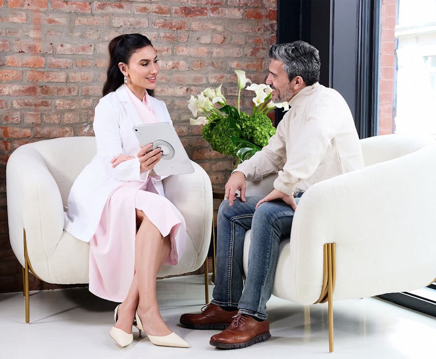 Mariesa Porter showing ipad to male patient