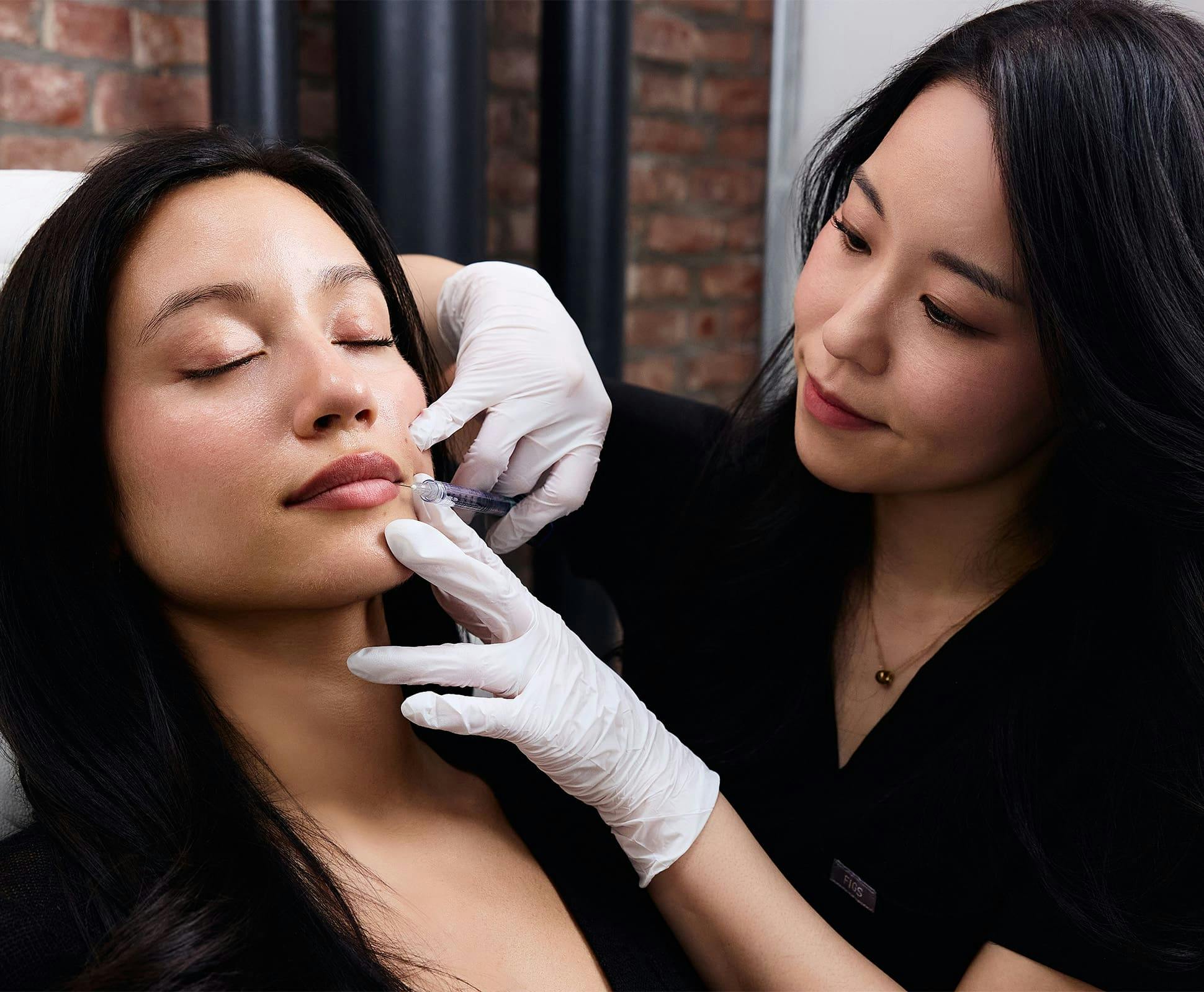 Chelsea Kim doing lip injections on a patient