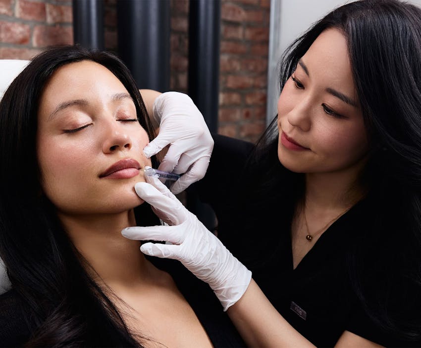 Chelsea Kim doing lip injections on a patient