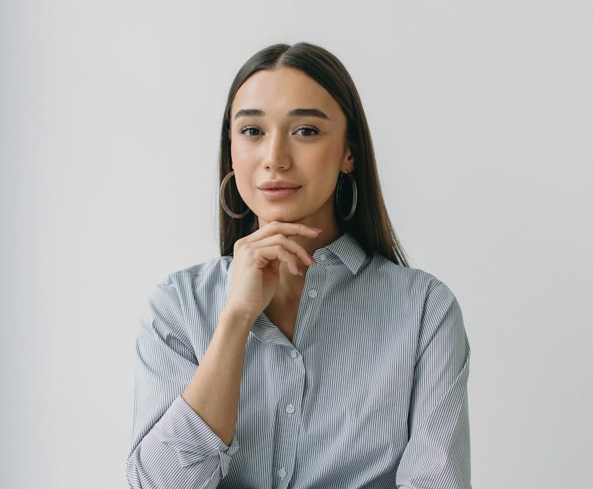 woman with her hand on her chin
