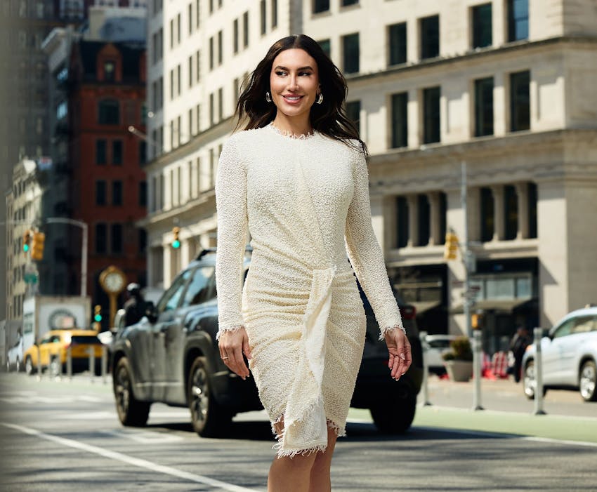 Mariesa Porter smiling and walking on city street