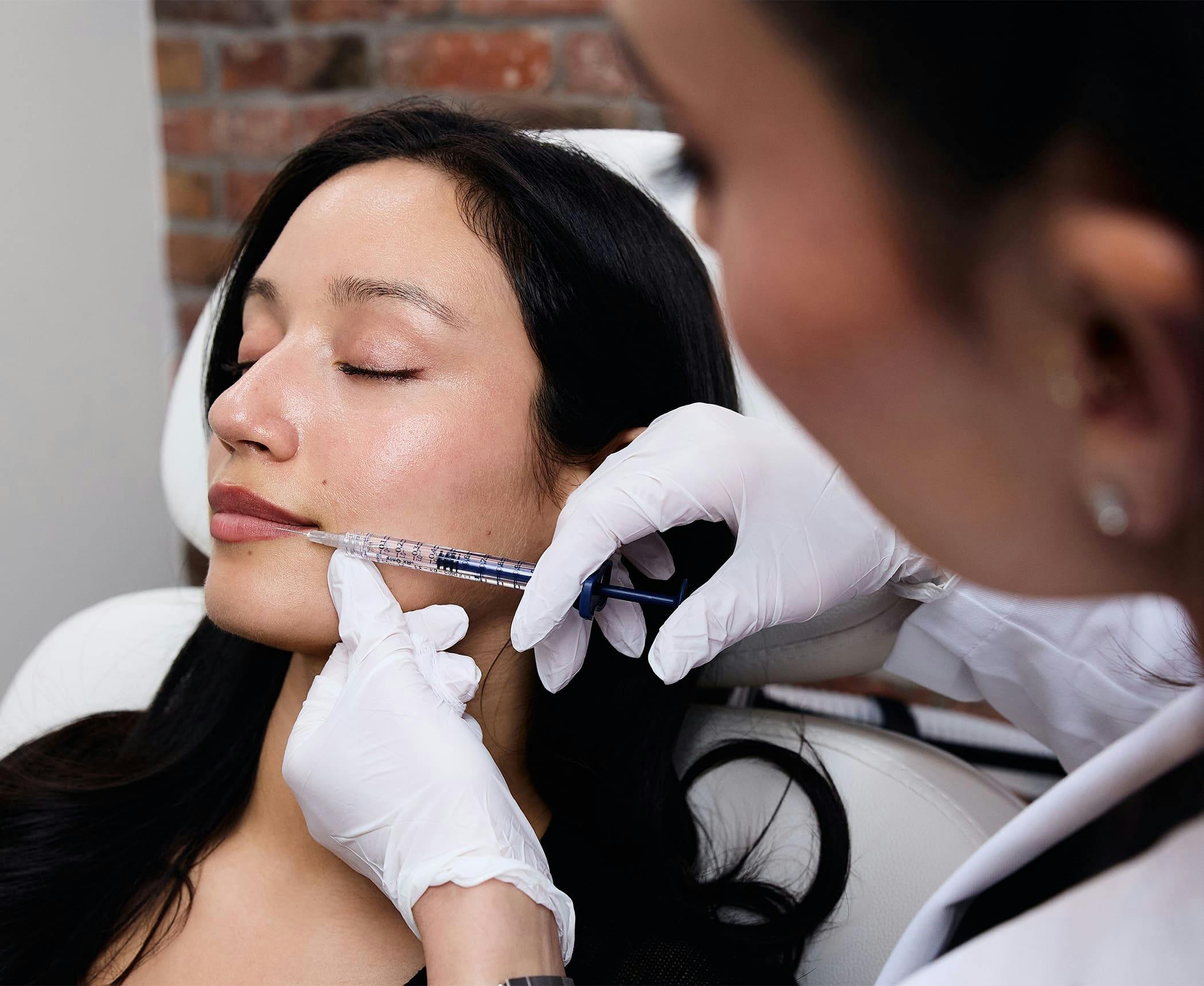 patient getting injection in her lip