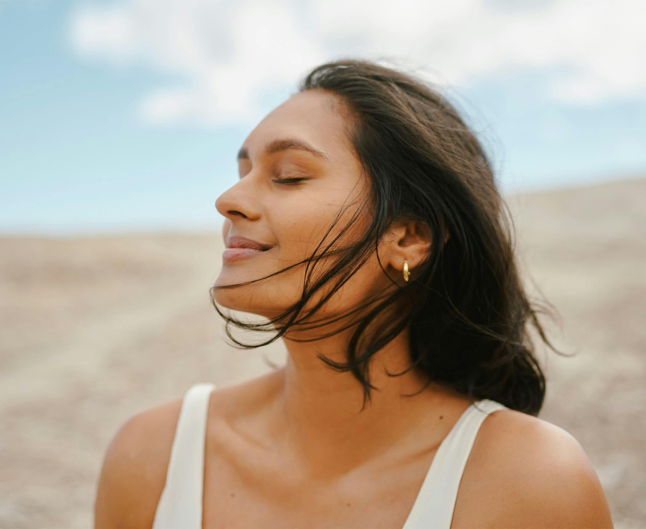 woman outdoors with the wind hitting her face