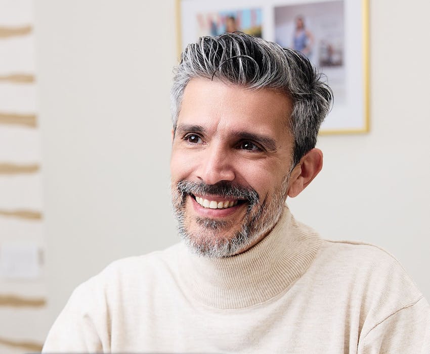 man smiling and looking forward