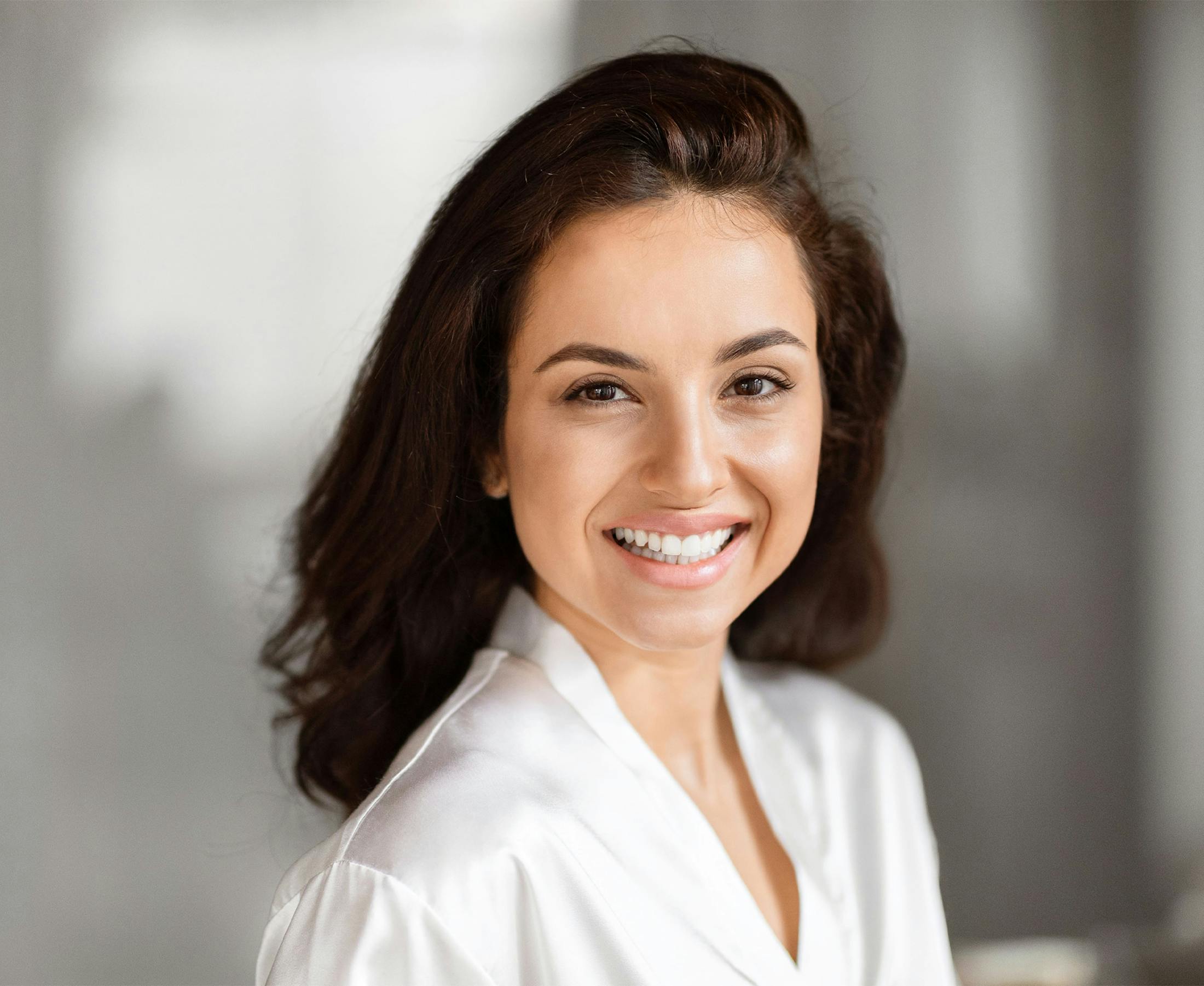 woman smiling in white shirt