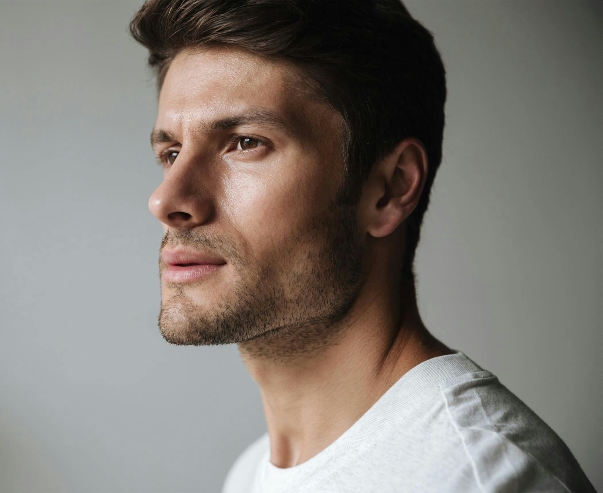 close up on man's face looking to the left
