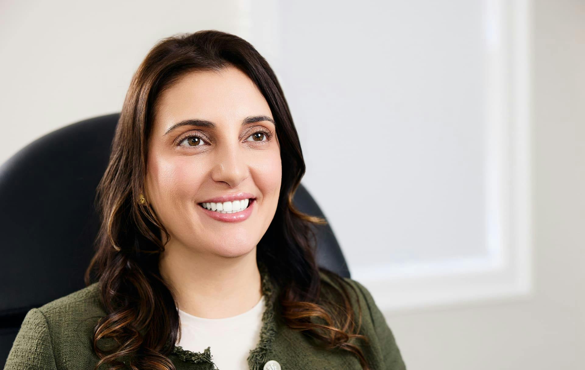 Woman smiling in a chair