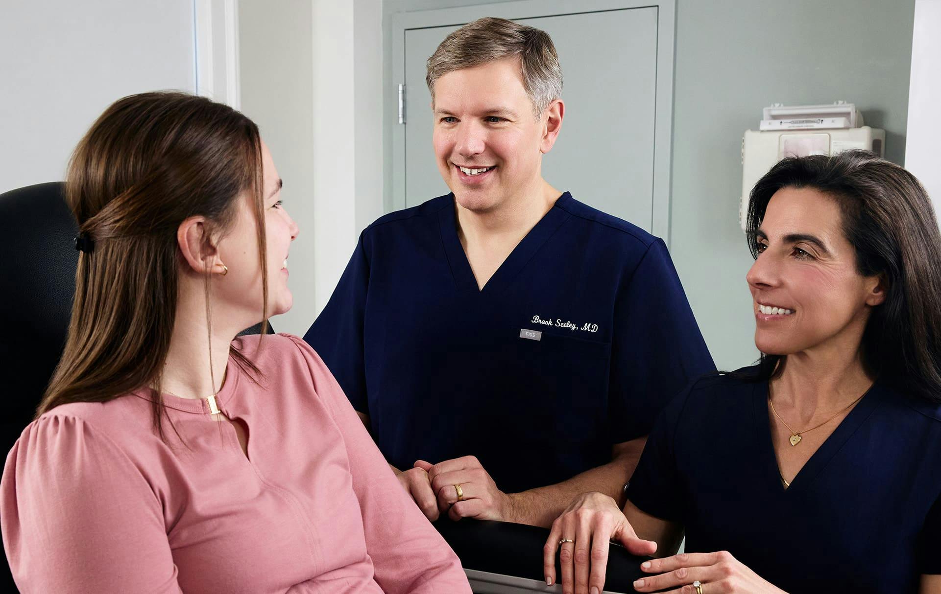 Doctors and patient speaking