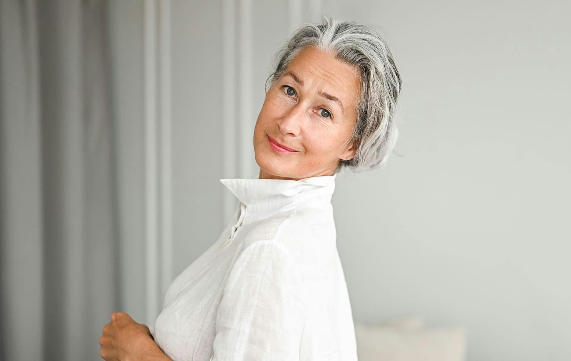 Woman looking over shoulder smiling