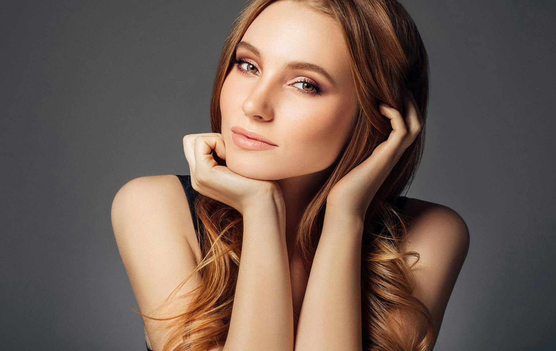 Woman resting her chin on her hand