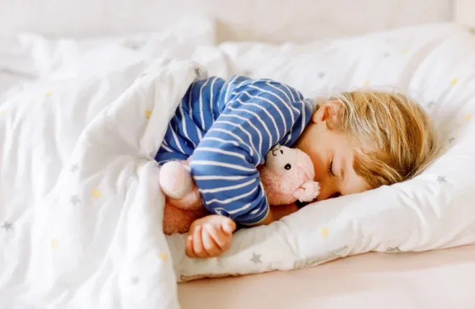 Baby sleeping in bed