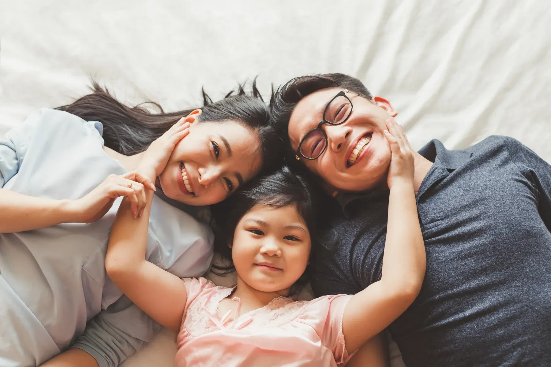 Happy family on bed