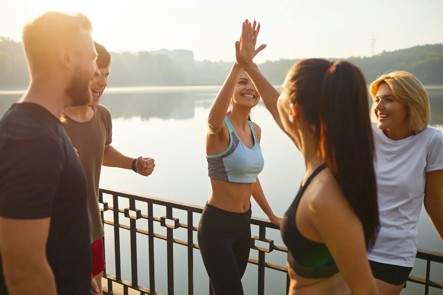 Group of people exercising outdoors Group of people exercising outdoors