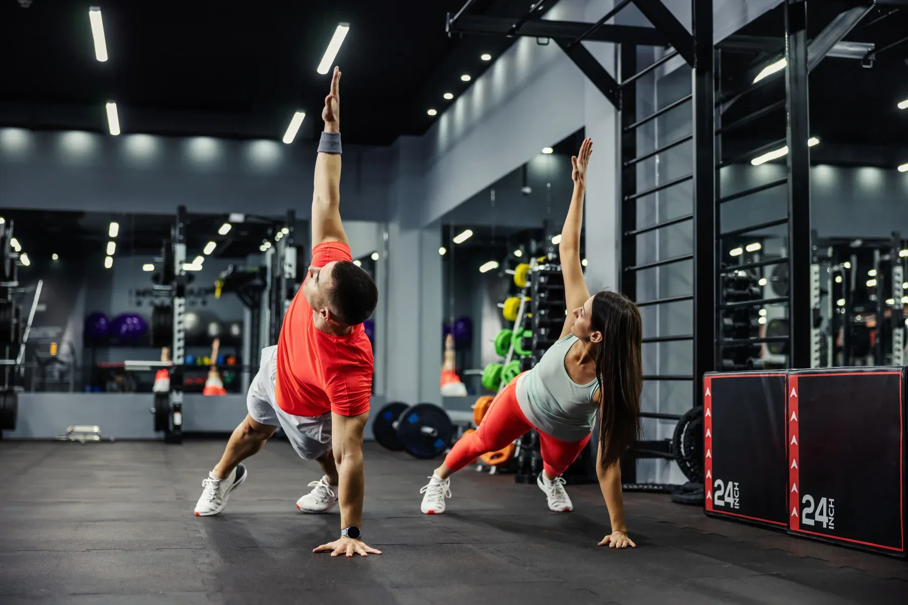 Two athletes working out in the gym