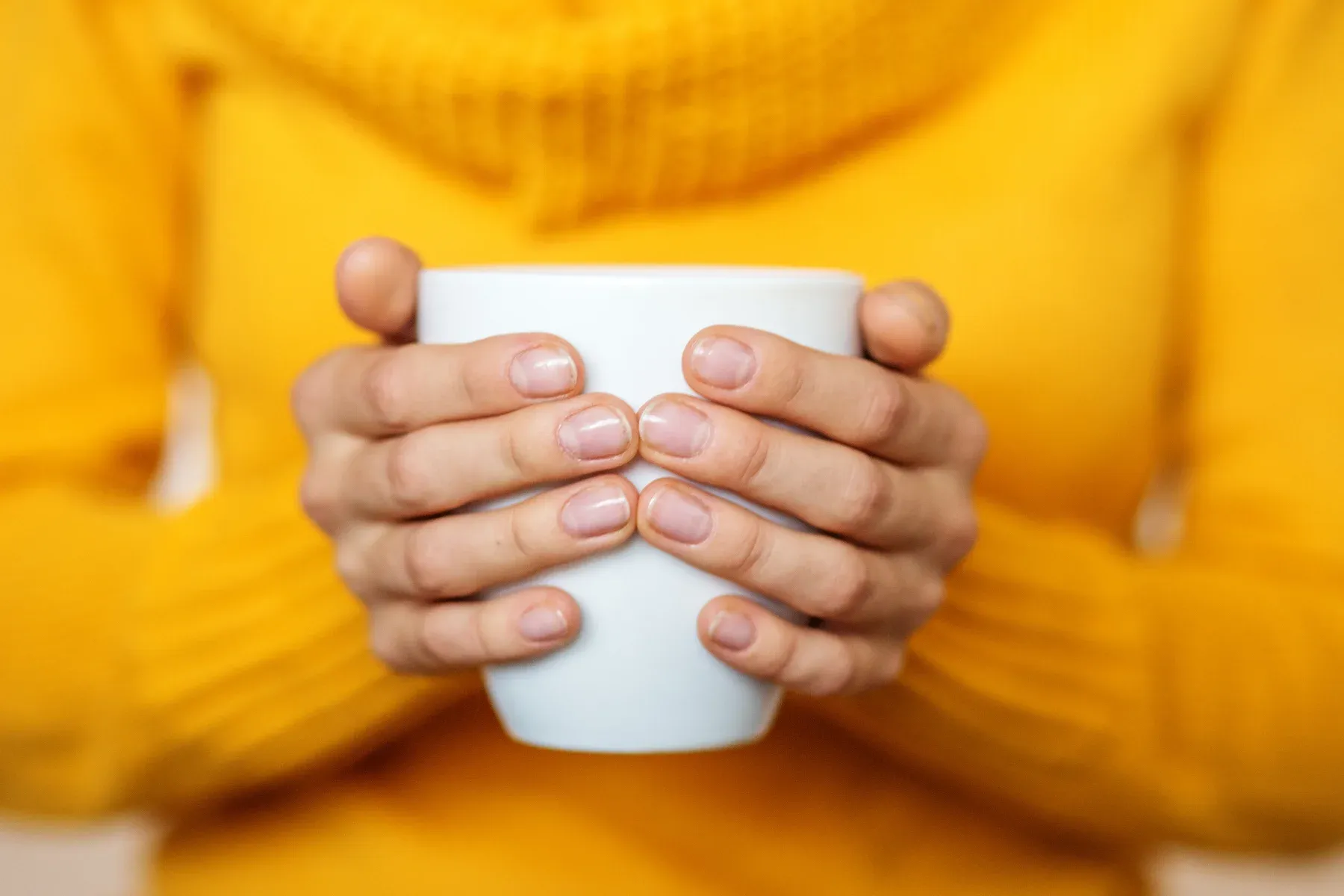 Holding a cup of warm milk