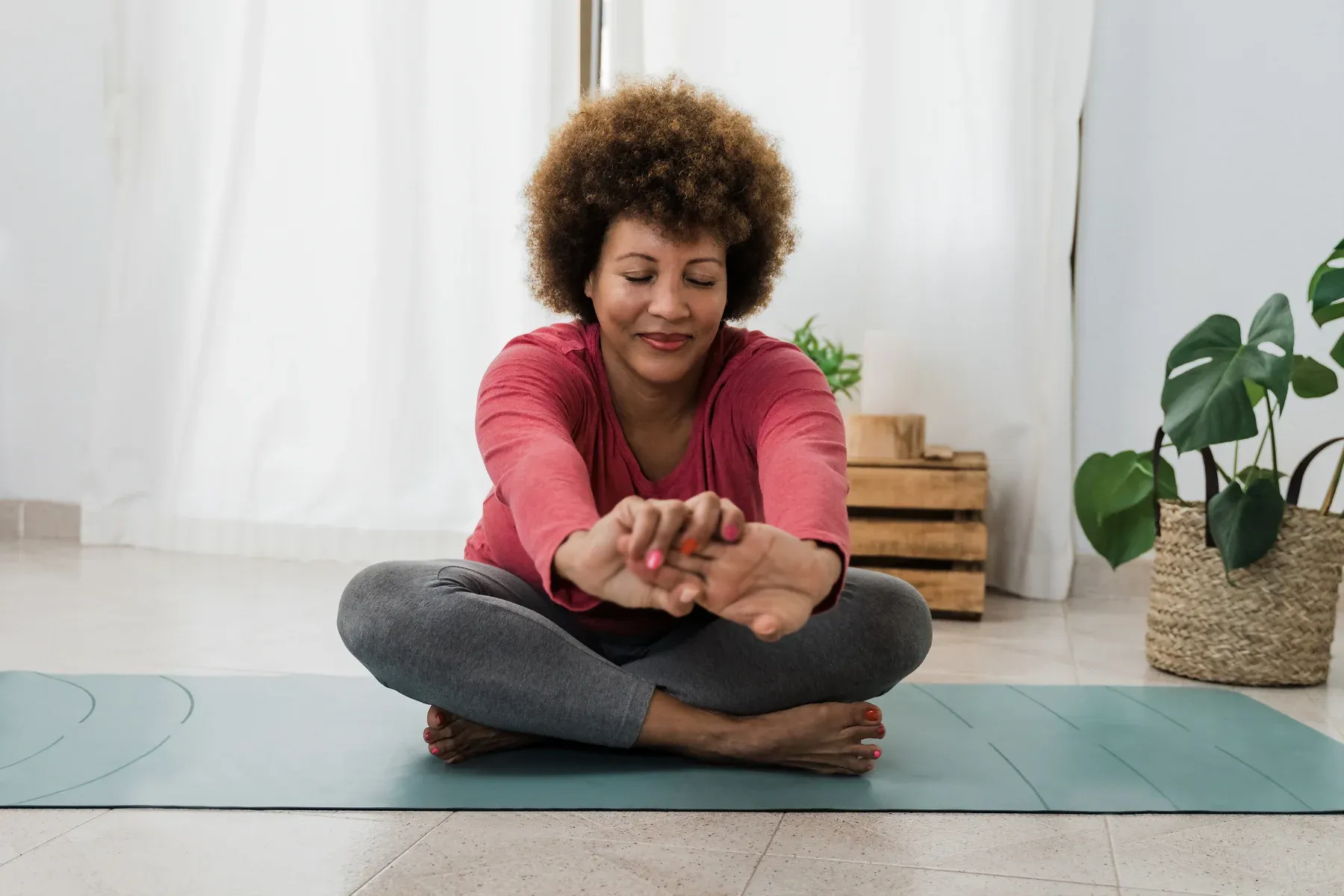 Women stretching on yoga mat