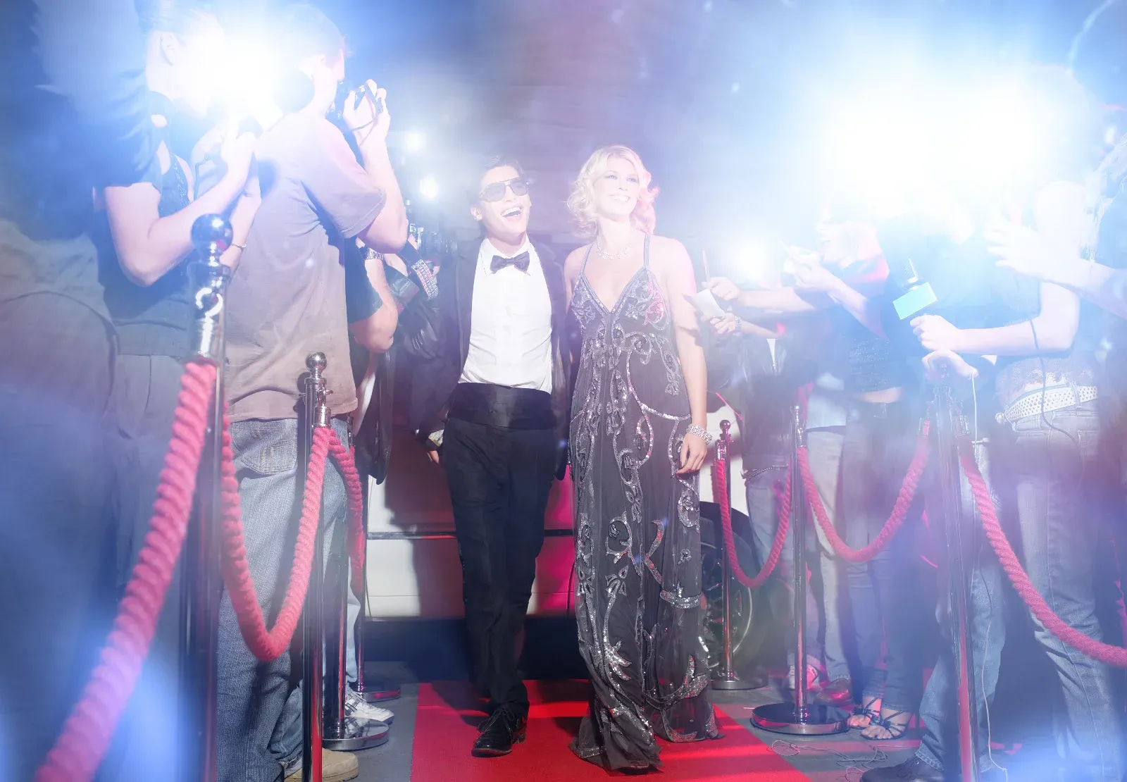 Celebrity walking down red carpet