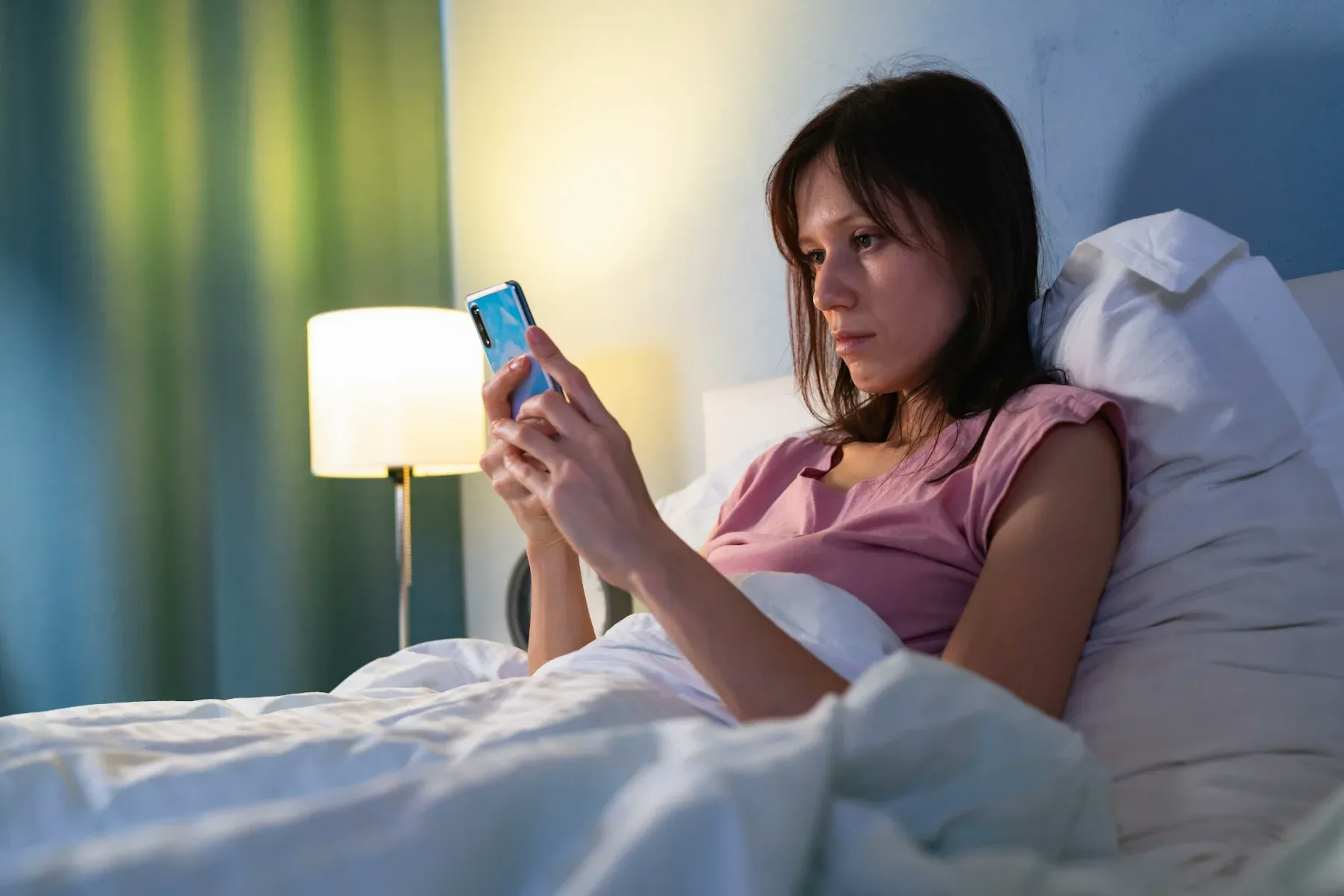 Scrolling social media in bed