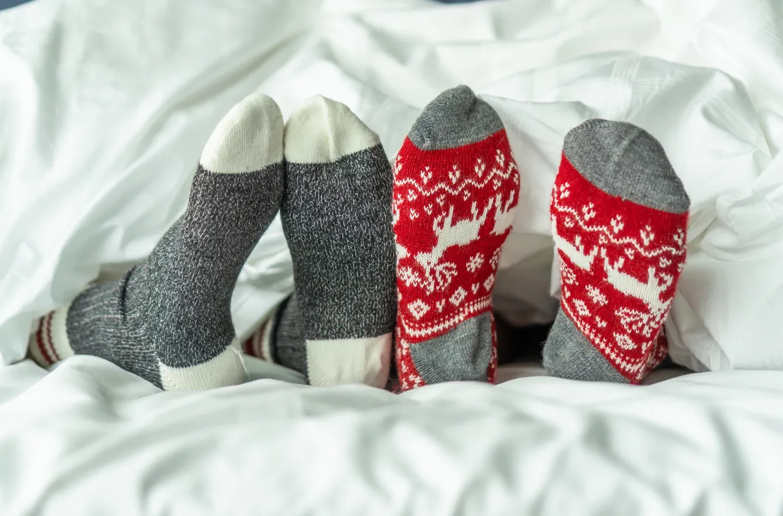Wearing cozy socks in bed