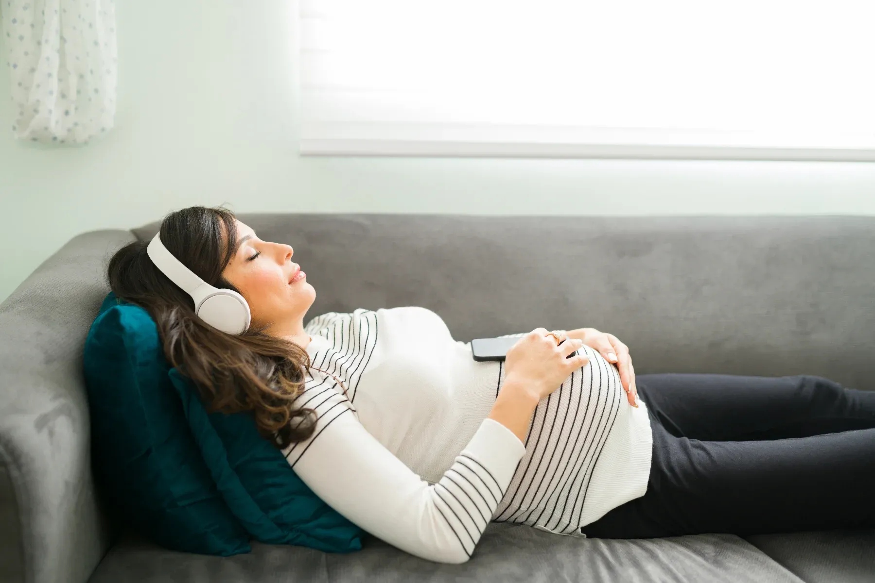 Pregnant women falling asleep to music