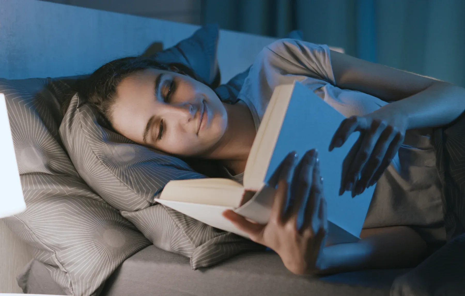 Women reading in bed before sleeping