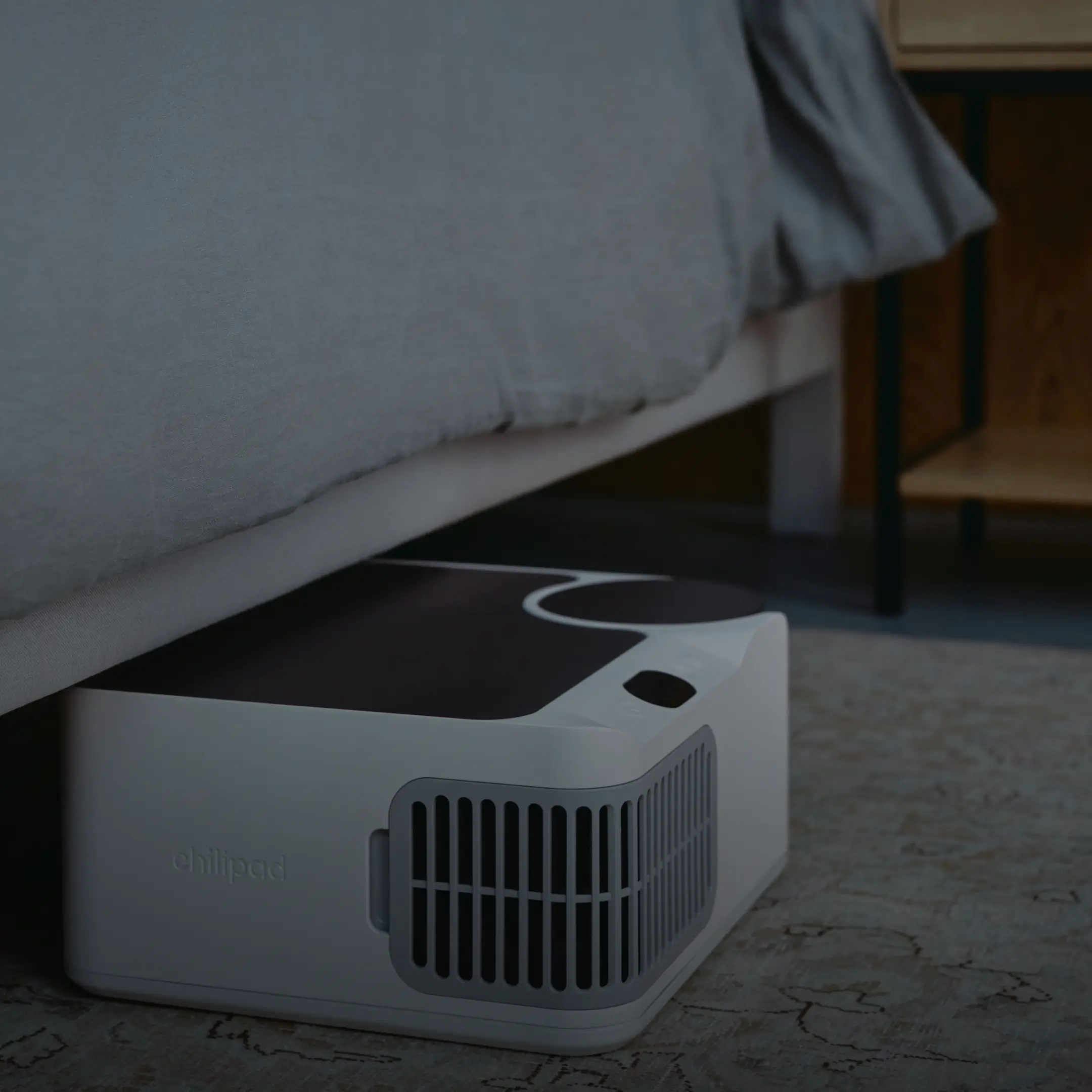 Chilipad Dock Pro cooling system unit positioned under bed frame