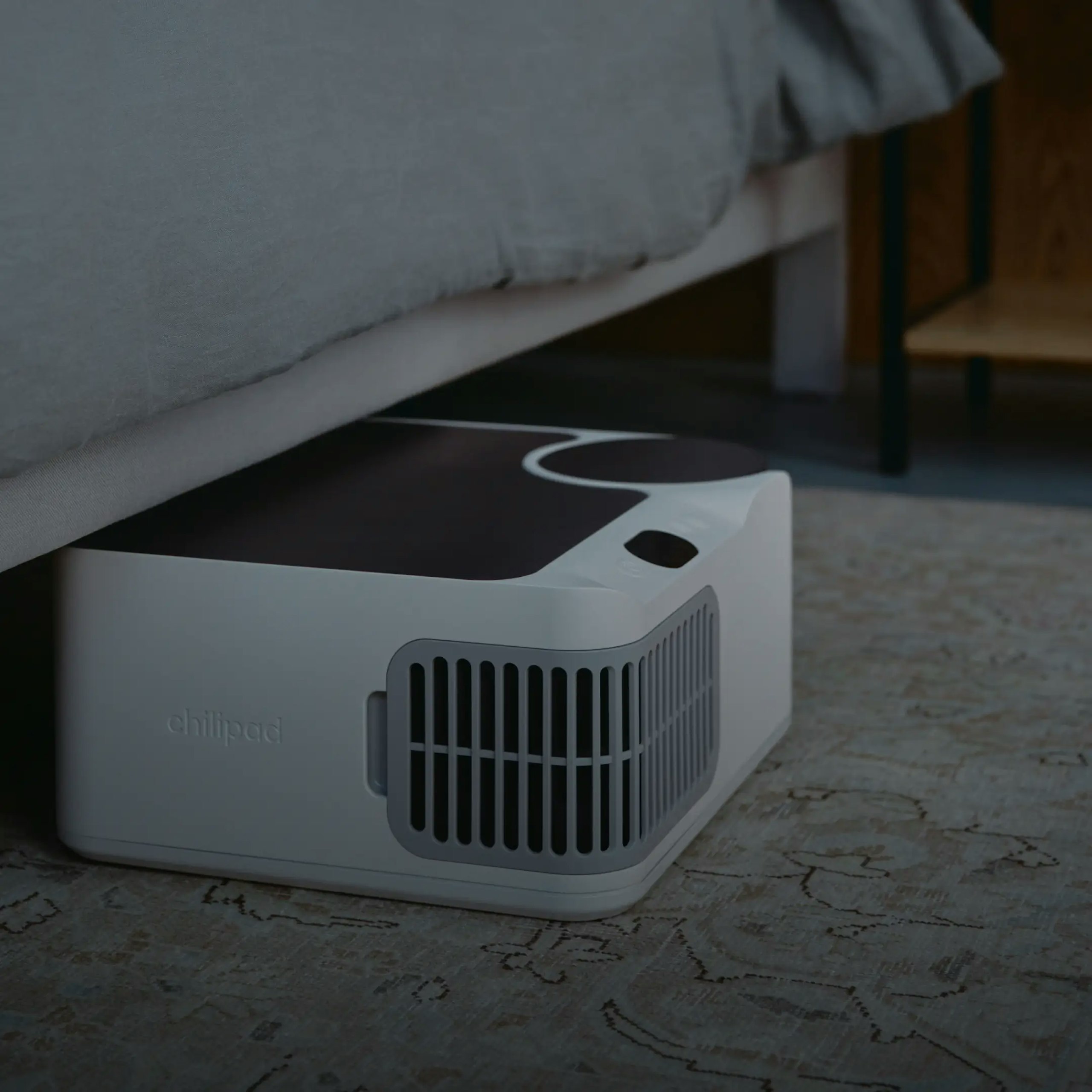 Chilipad Dock Pro cooling system unit positioned under bed frame