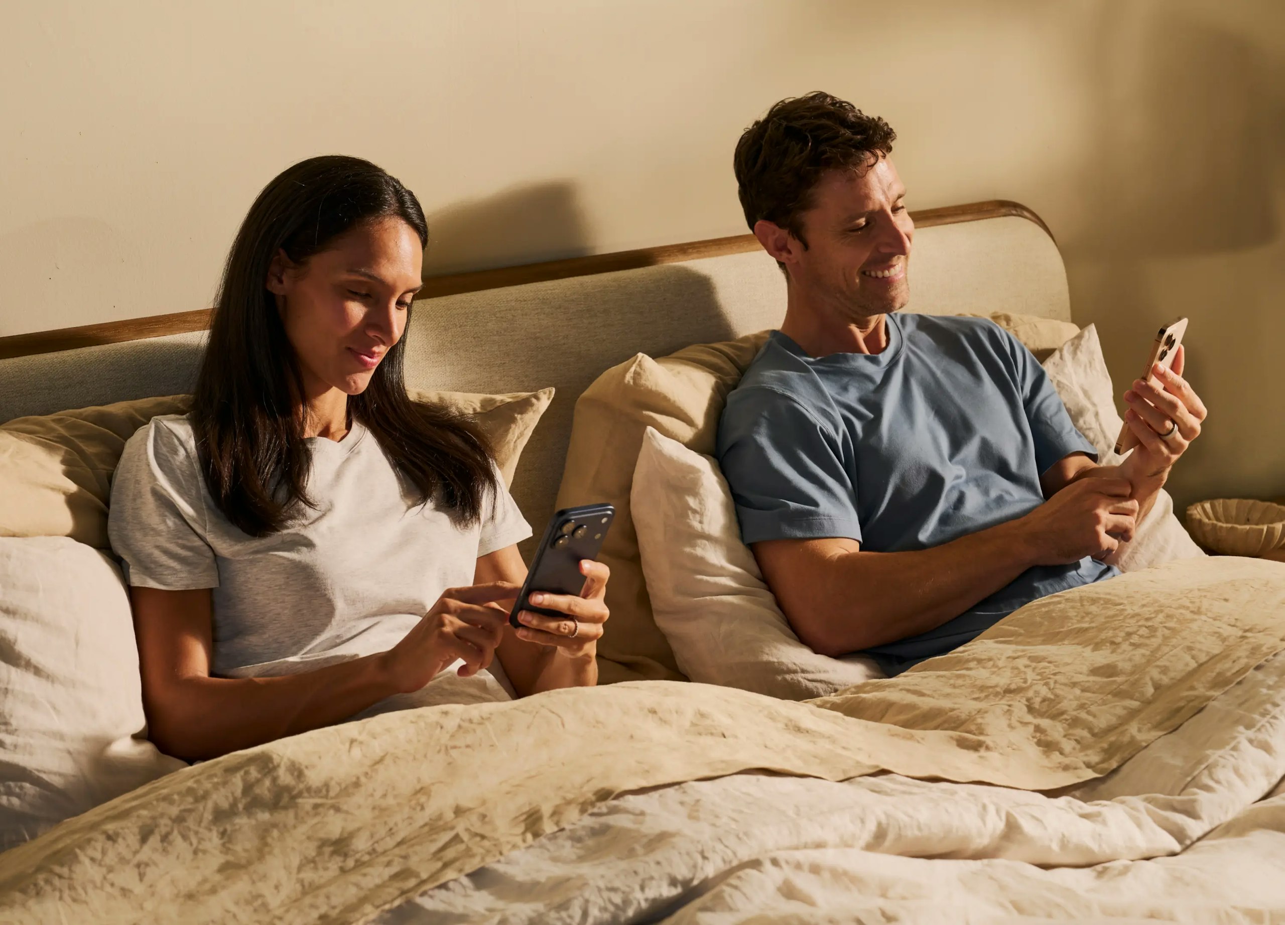 Couple in bed on the Chilipad App