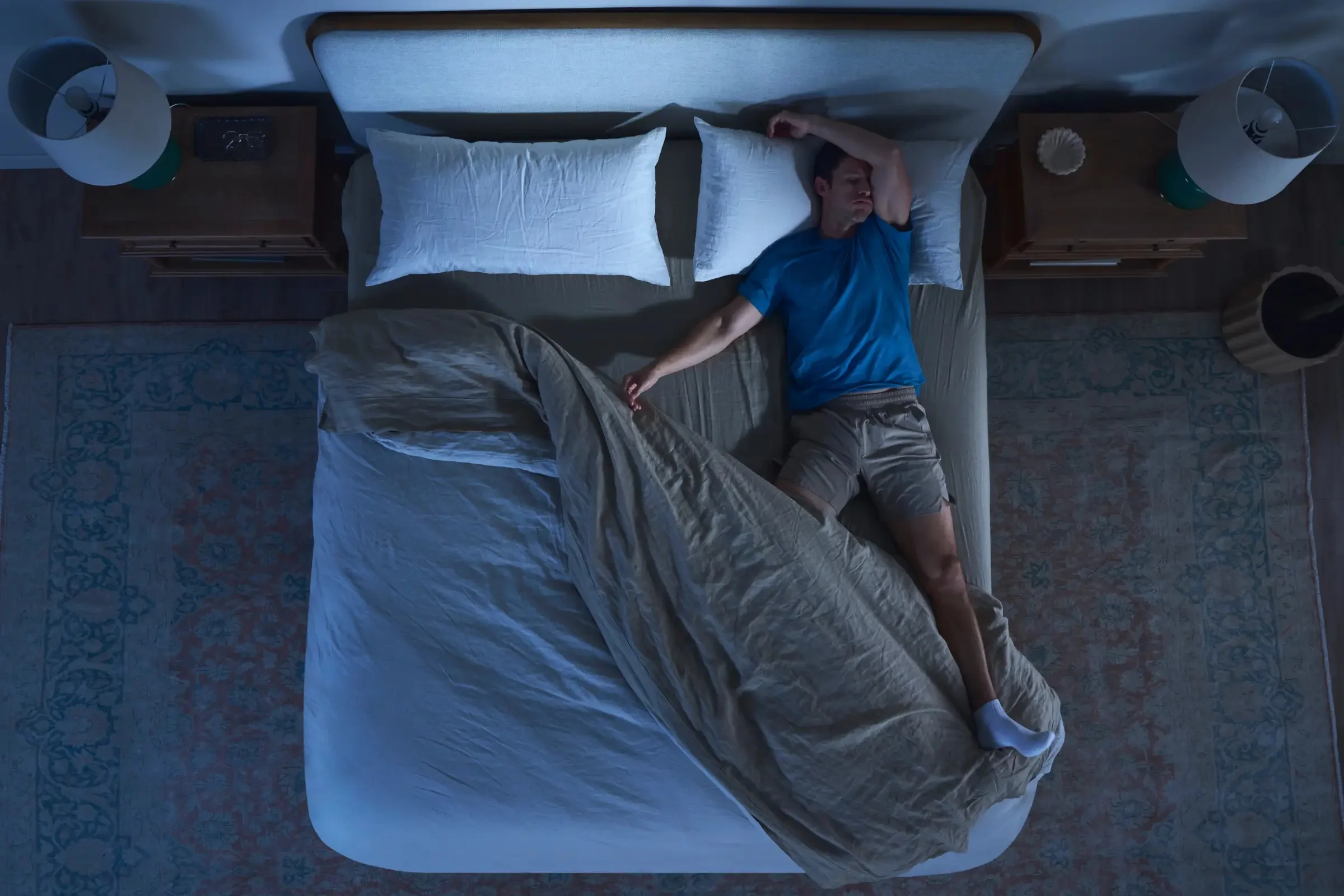 Man sweating at night by sleeping hot