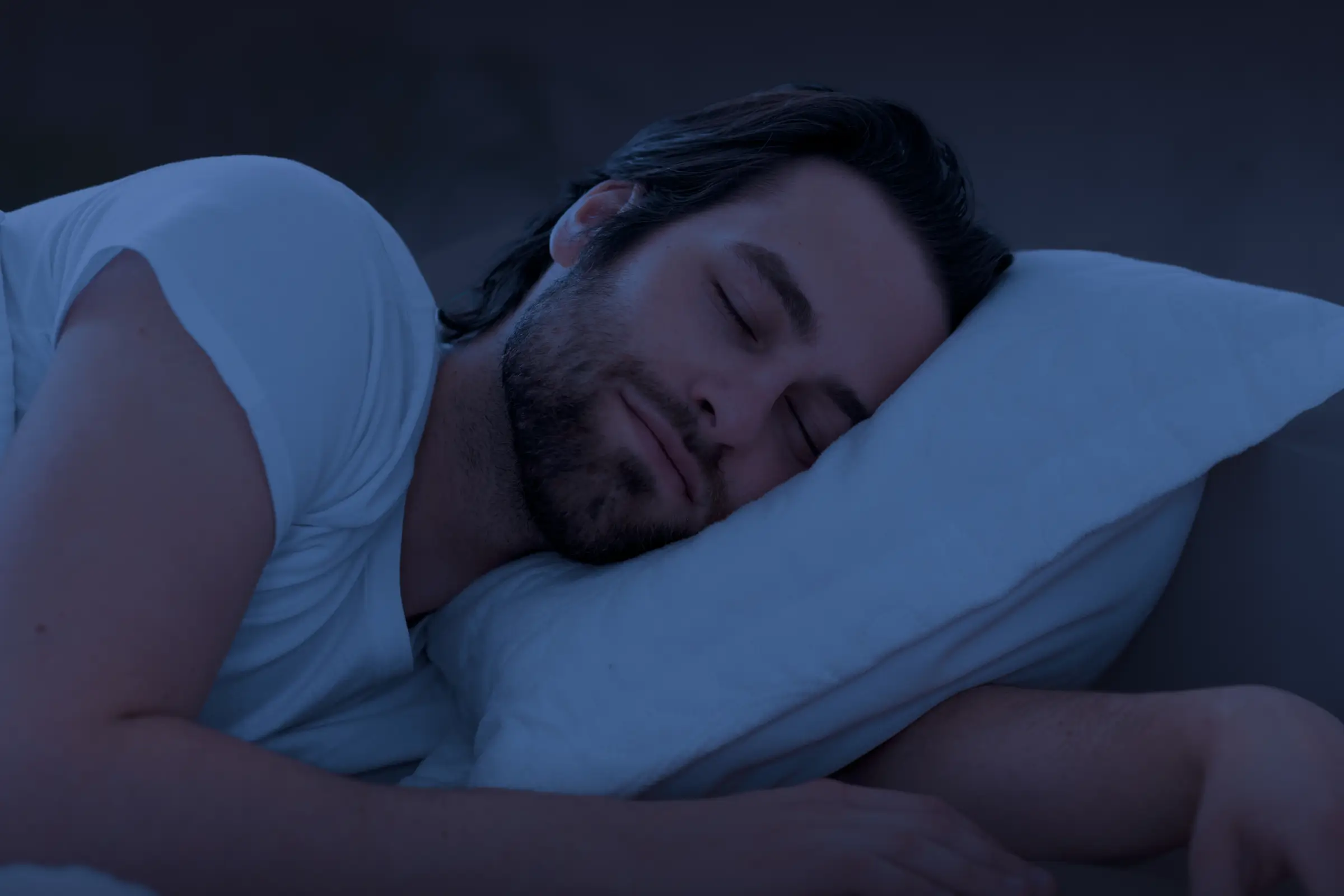 Man sleeping in a cool temperature environment
