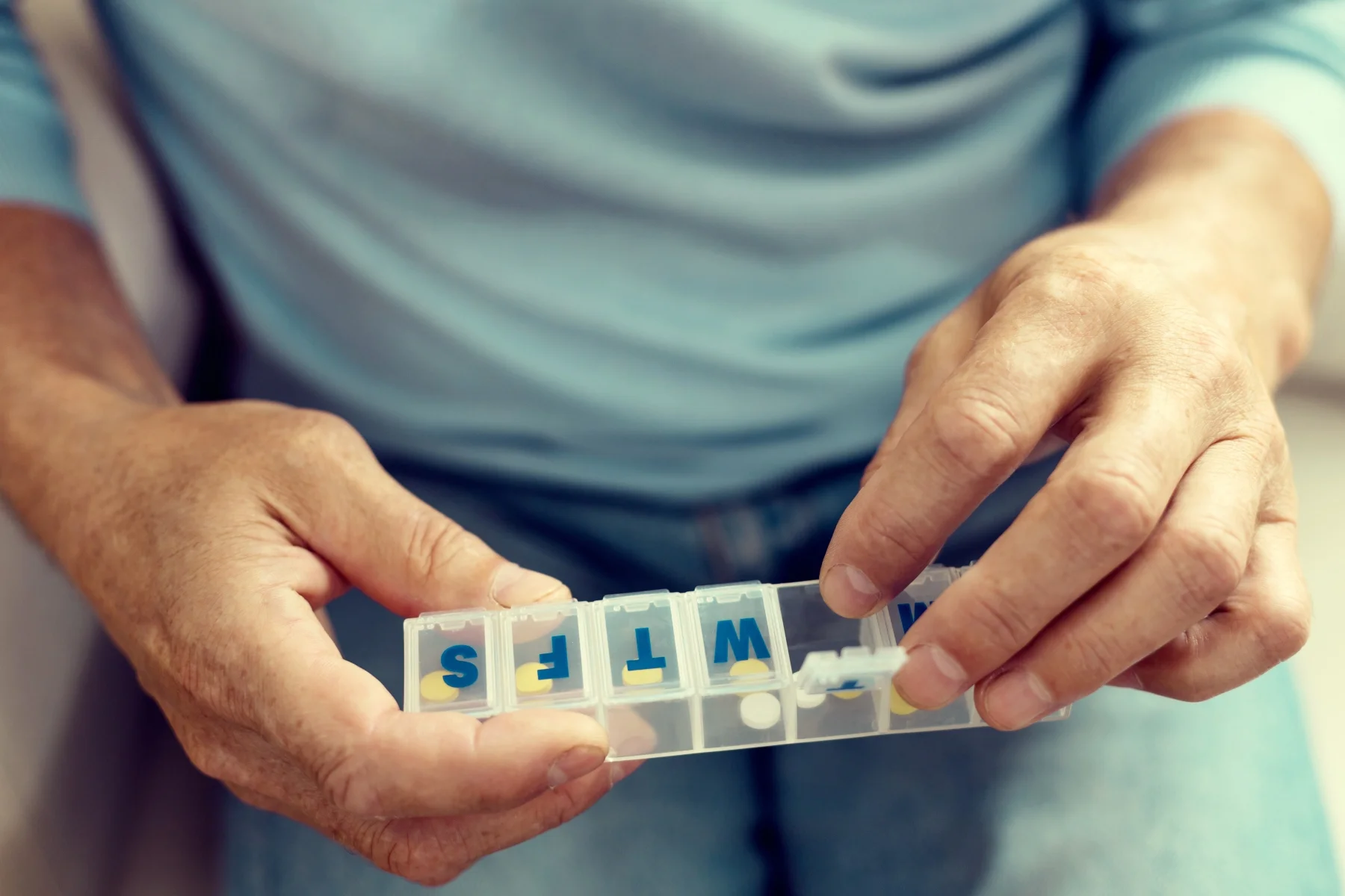 Medications on a nightstand that may cause night sweats as a side effect
