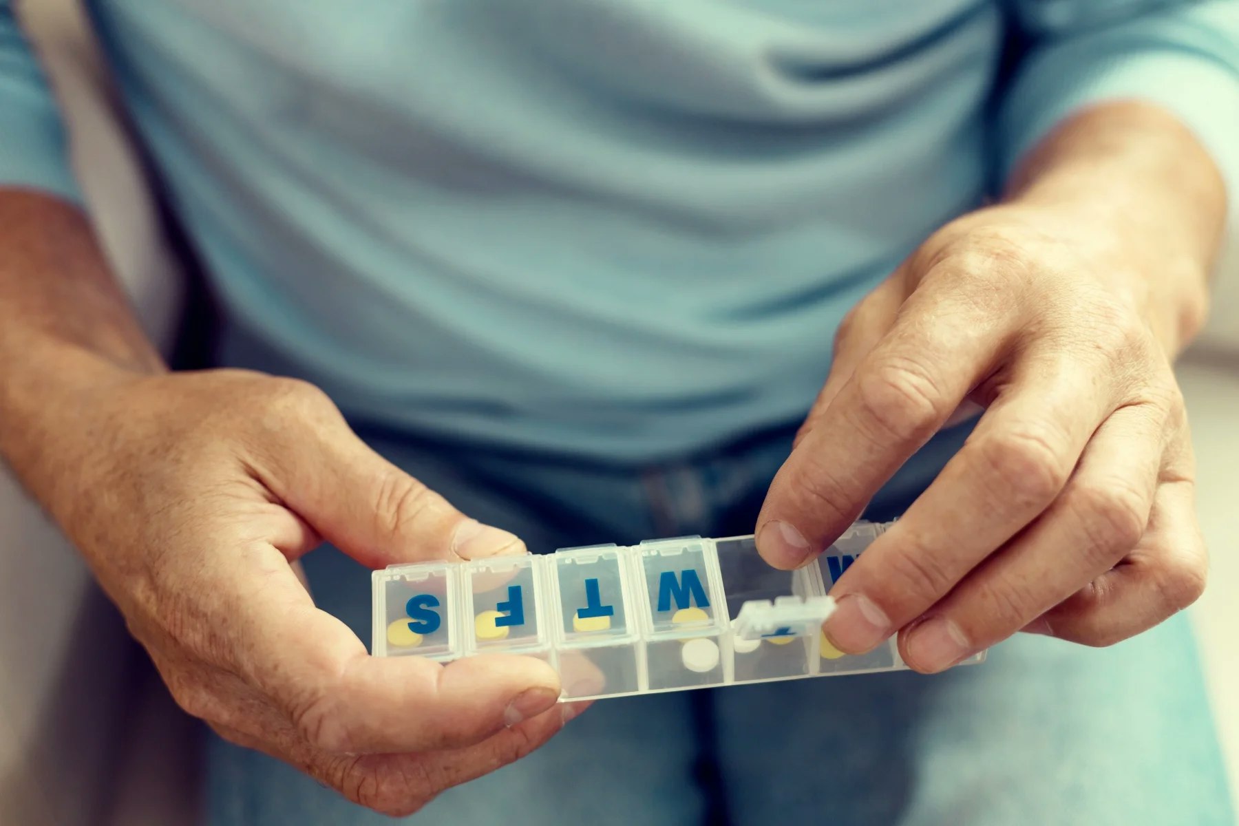 Man with Medicine Pill Organizer Man with Medicine Pill Organizer