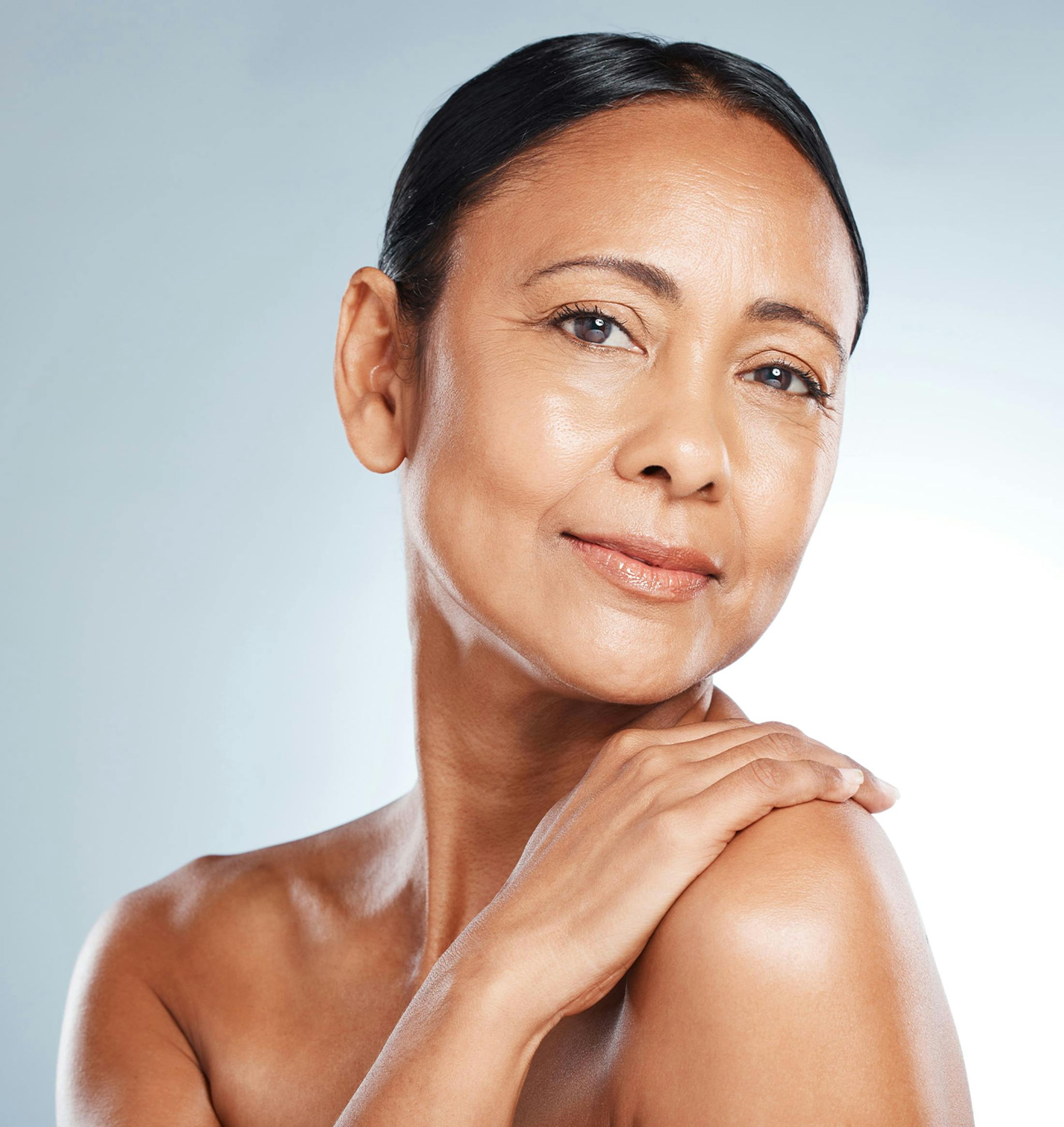 woman with her hand on her shoulder