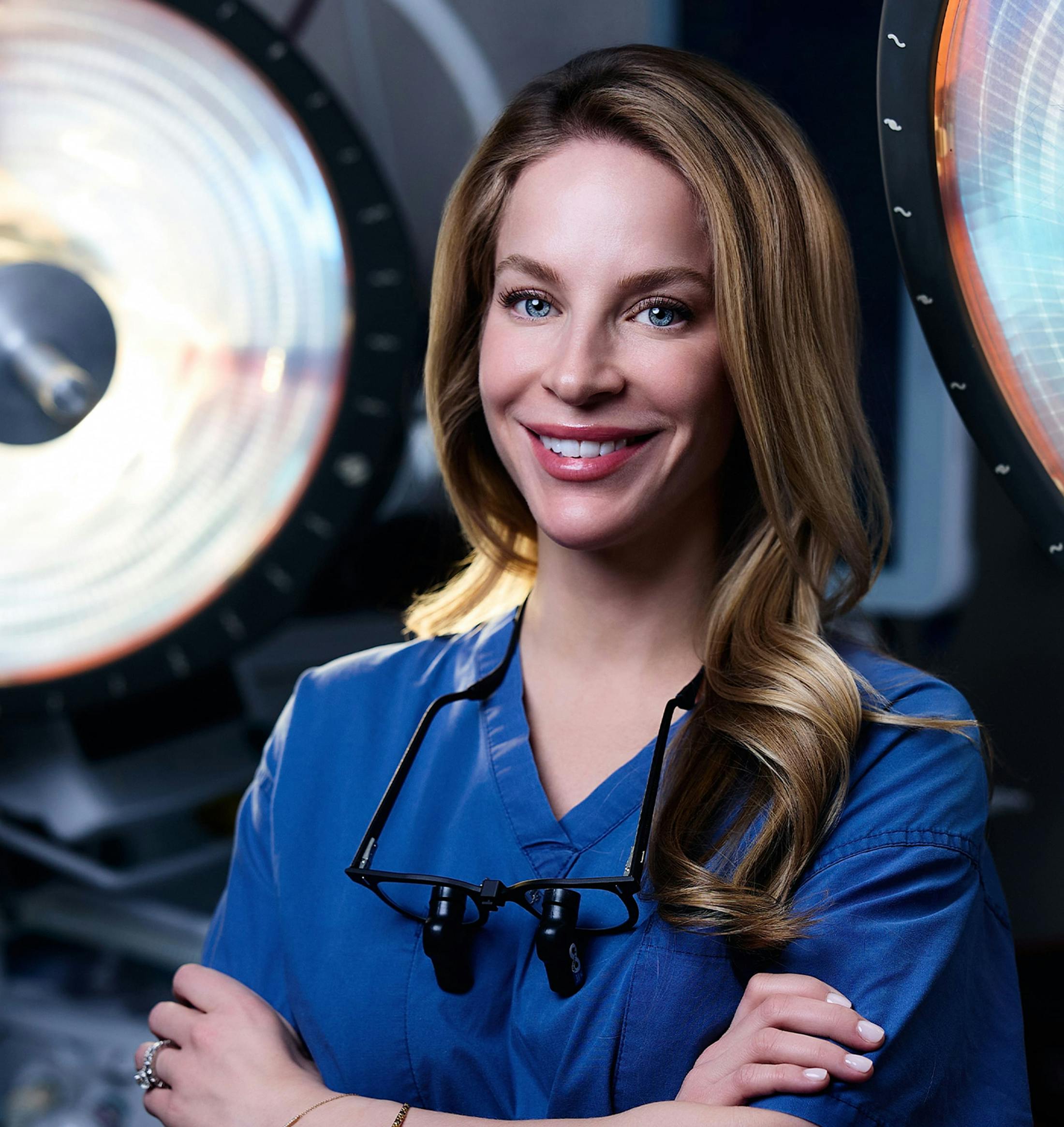 Dr. Allison smiling and crossing her arms