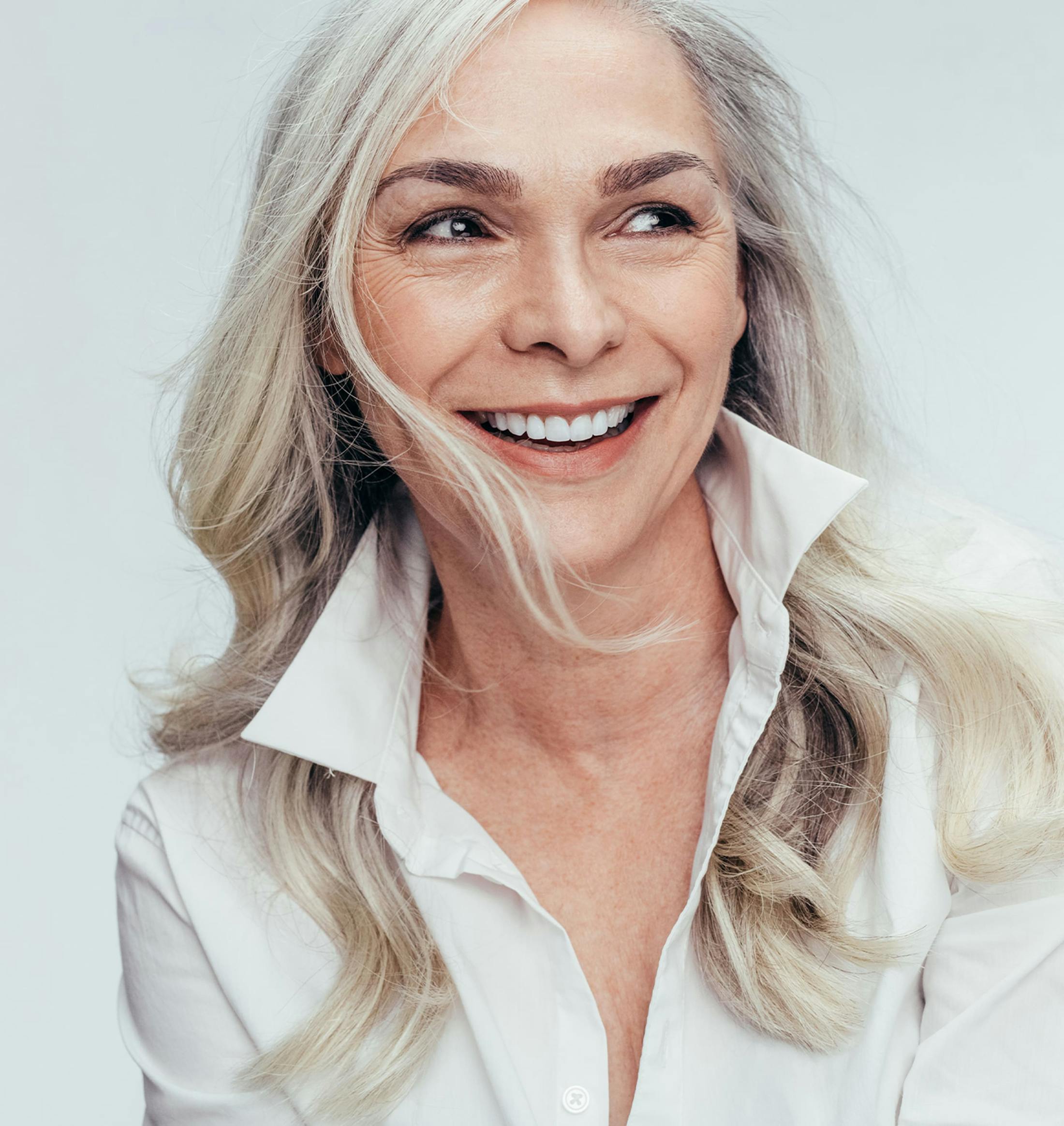 woman with grey hair smiling