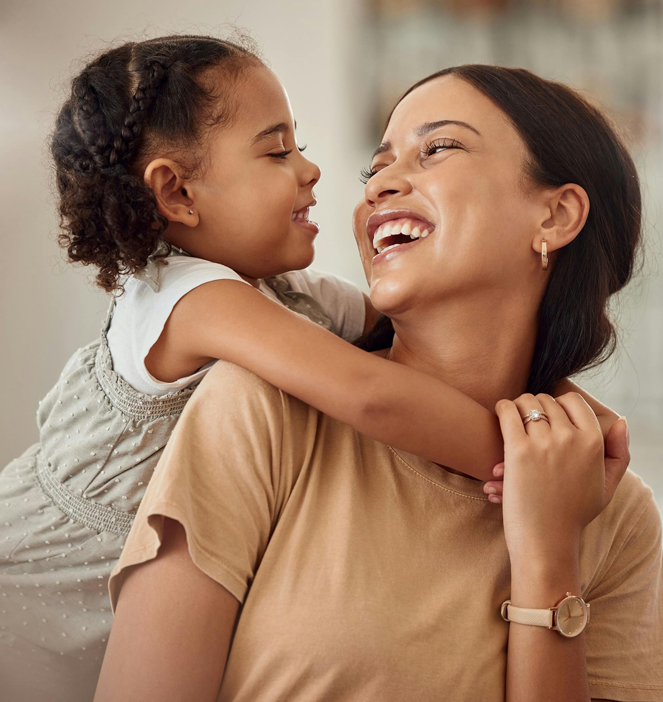 woman with her daughter smiling together