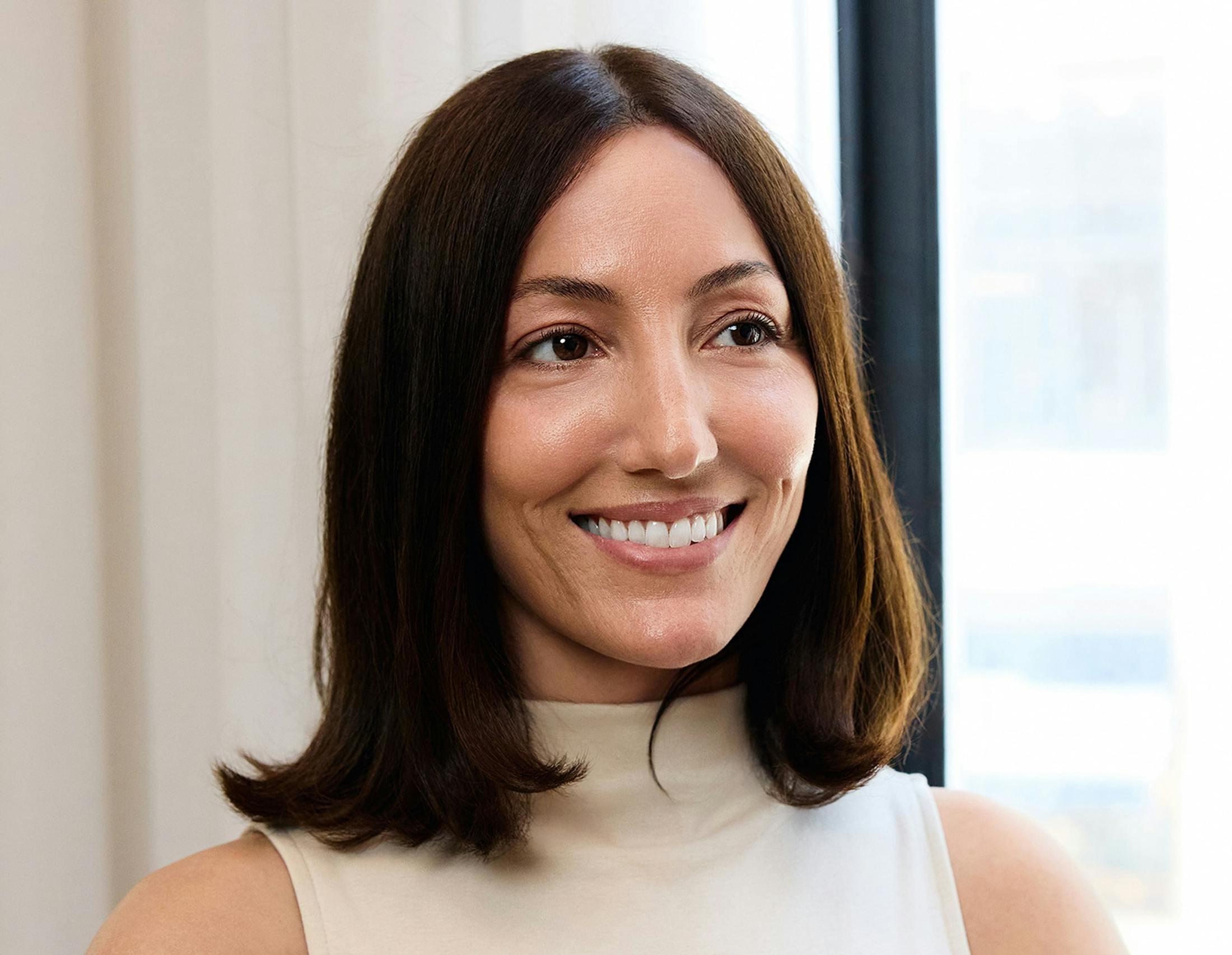 female patient with short hair and smiling