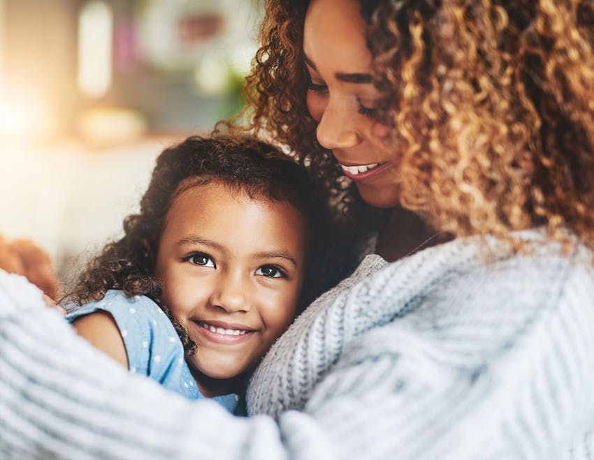 daughter laying on her mother