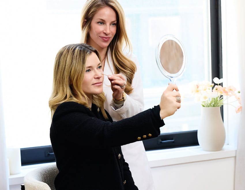 female patient getting her eyes viewed by Dr. Allison