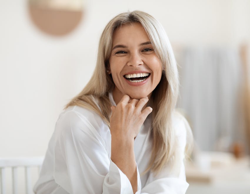 woman with her hair up and looking to the right