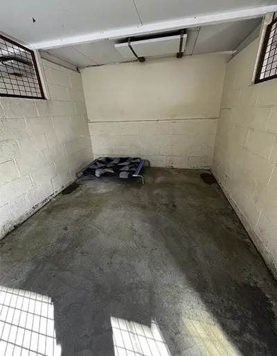 A wide view of the dog guest room with heater for large dogs at Welcome Kennels and Cattery