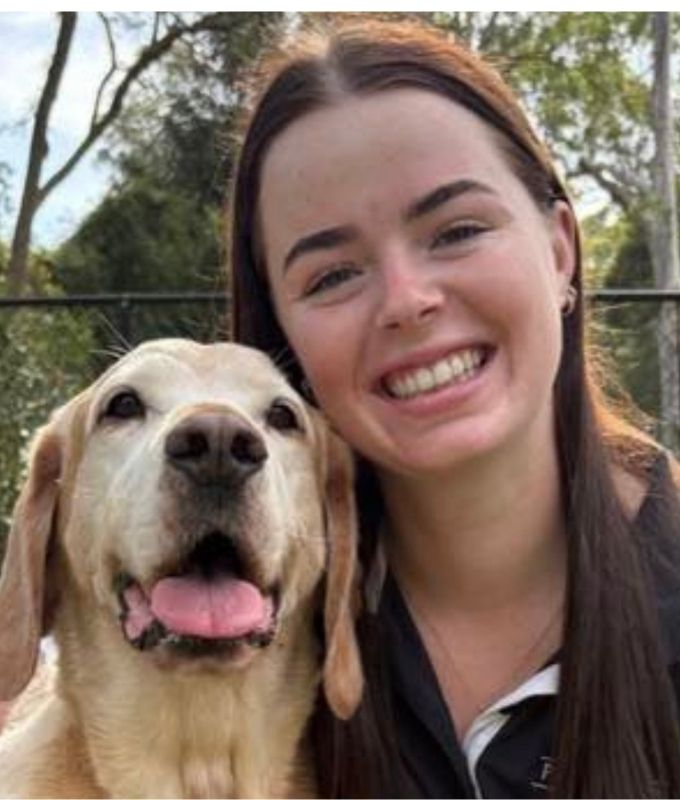Pet Resorts Australia Kangy Angy Manager Brooke with happy labrador