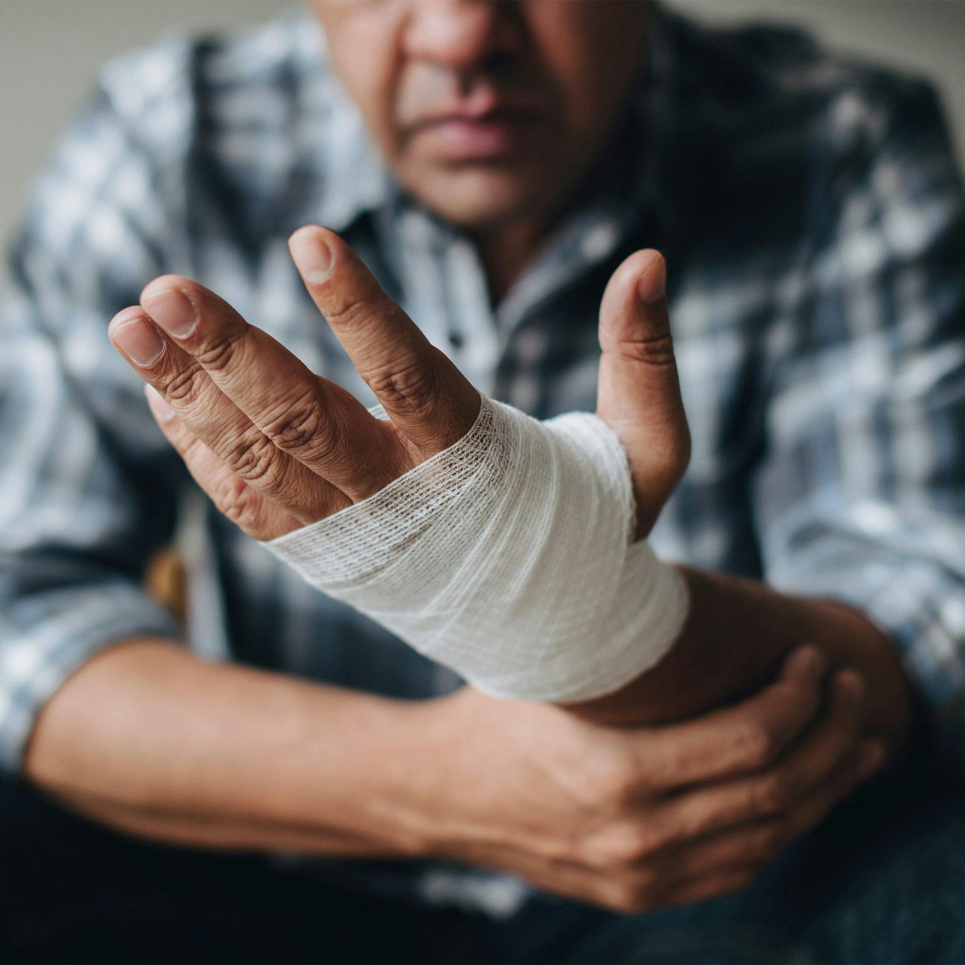 man holding his wrapped arm