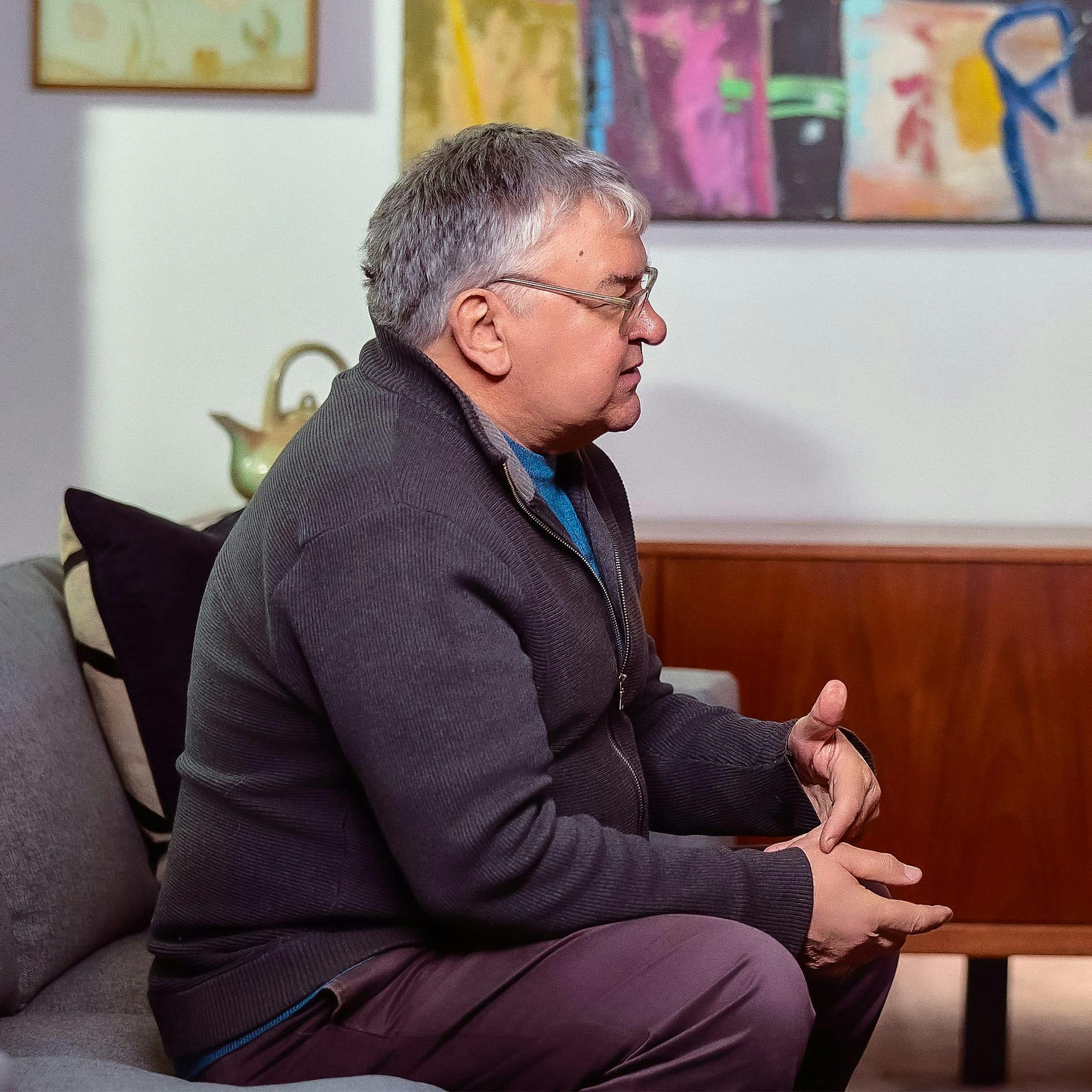 older man sitting on a couch